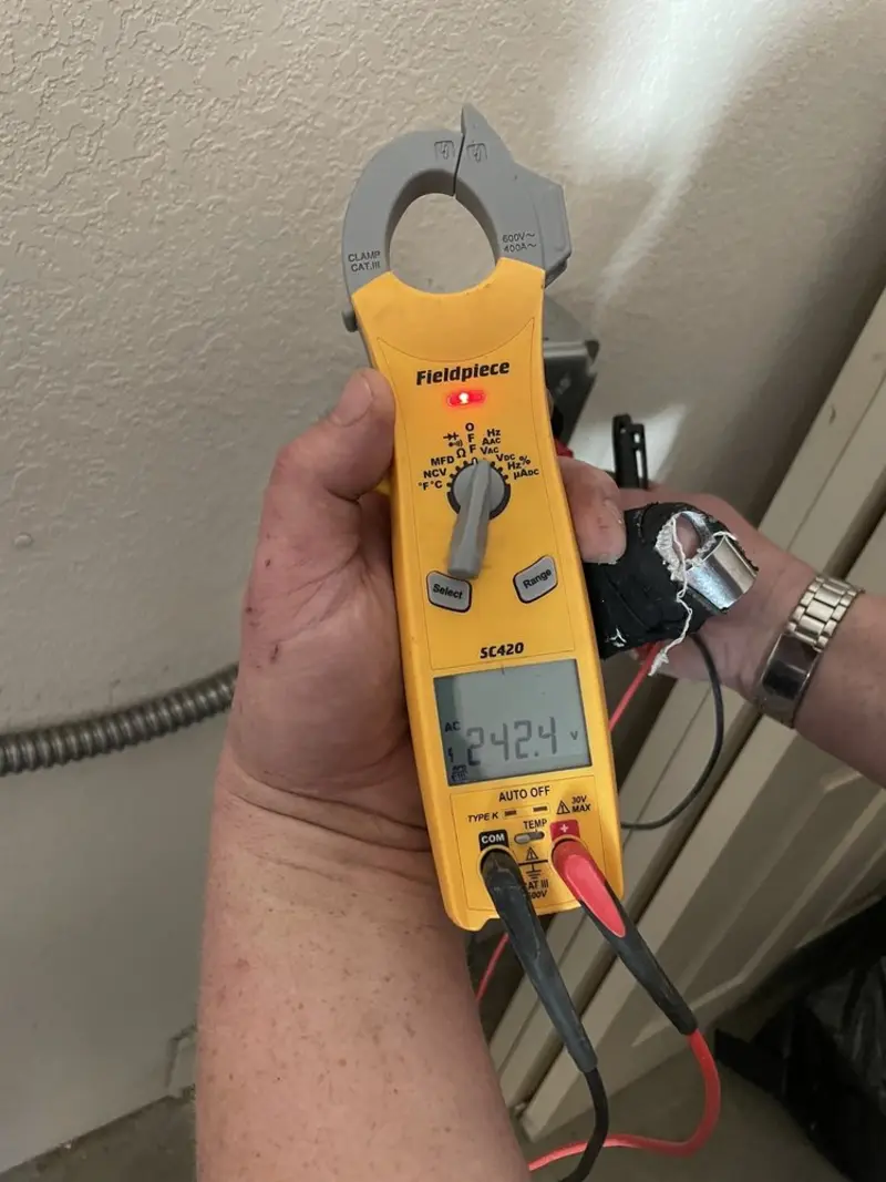 Voltage testing with clamp meter during Electrical Installation Services in Hounsfield